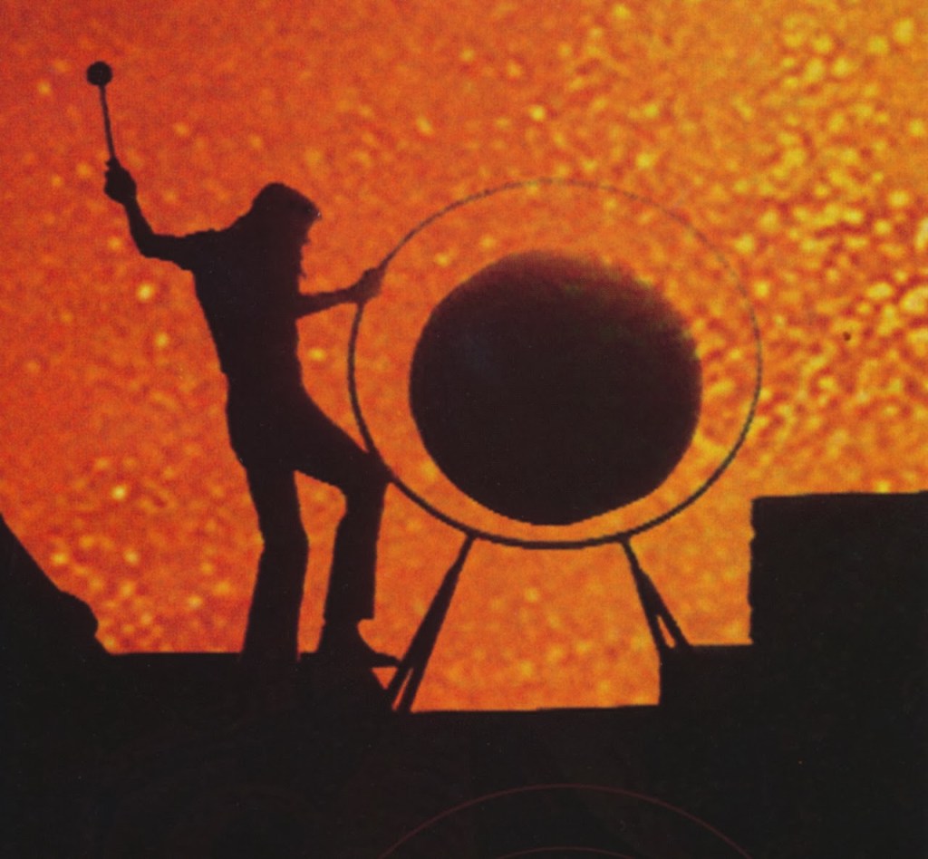Roger Waters hitting a gong from the  movie Pink Floyd: Live at Pompeii