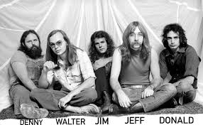 The band Steely Dan - group shot of them sitting on the floor