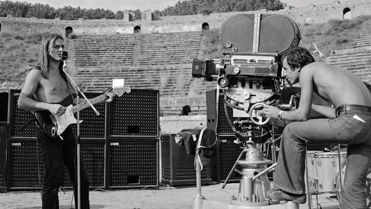 Pink Floyd at Pompeii - David Gilmour playing guitar while being filmed