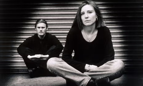 The band Portishead - members seated on the ground