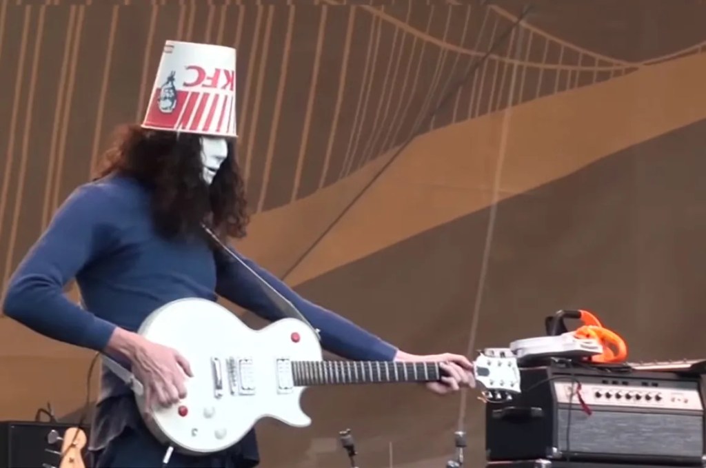 Guitarist Buckethead on stage with electric guitar