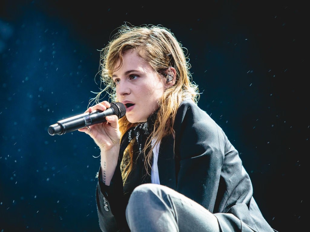 Singer / songwriter Rahim Redcar aka Christine and the Queens - singing in to microphone