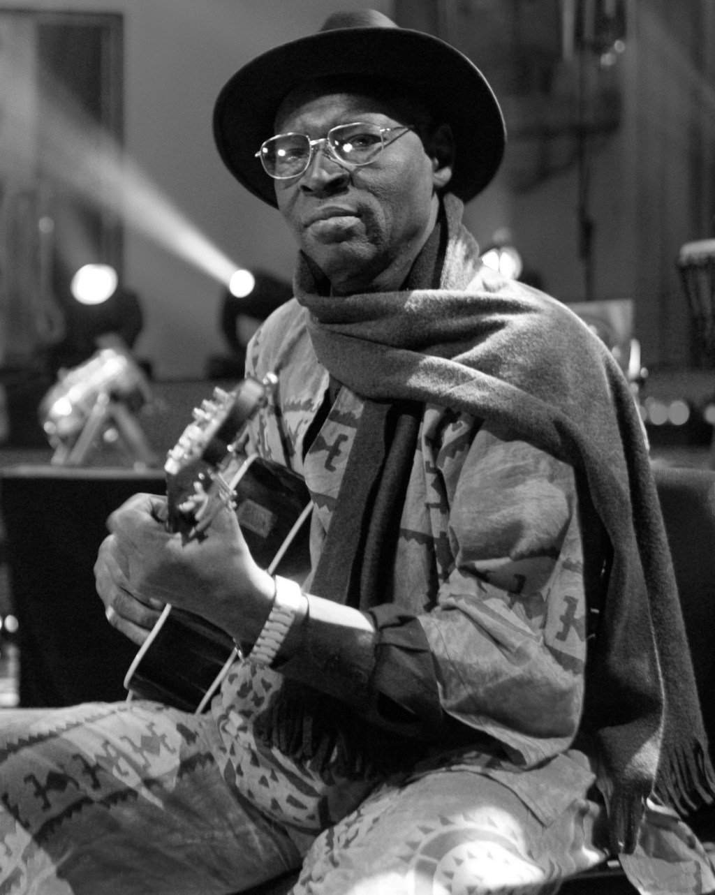 Ali Farka Touré sitting with guitar