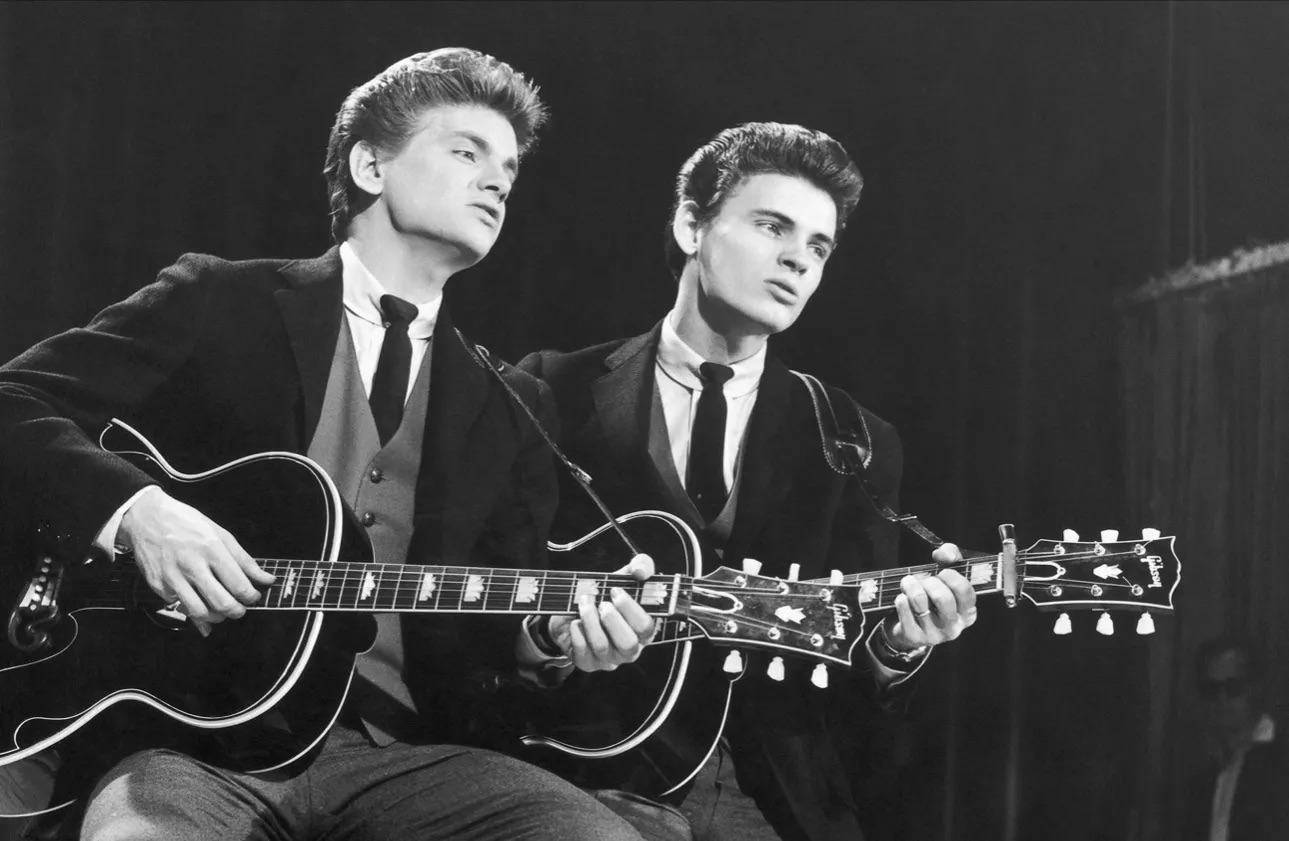The Everly Brothers holding acoustic guitars - circa 1960