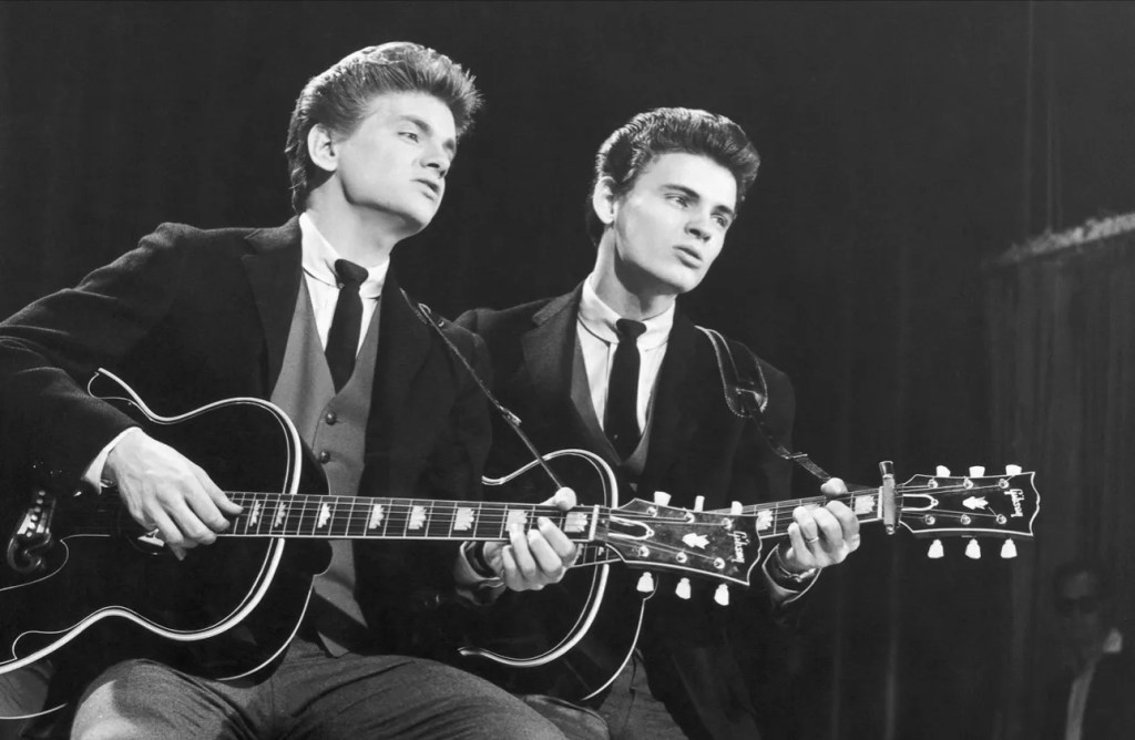 The Everly Brothers holding acoustic guitars - circa 1960