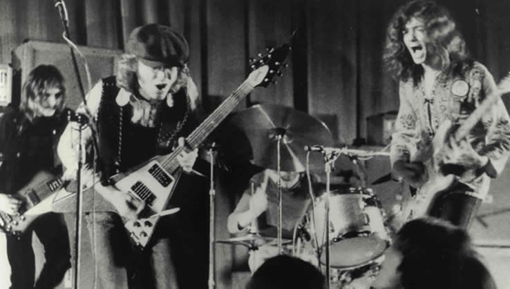 The band Wishbone Ash on stage energetically performing