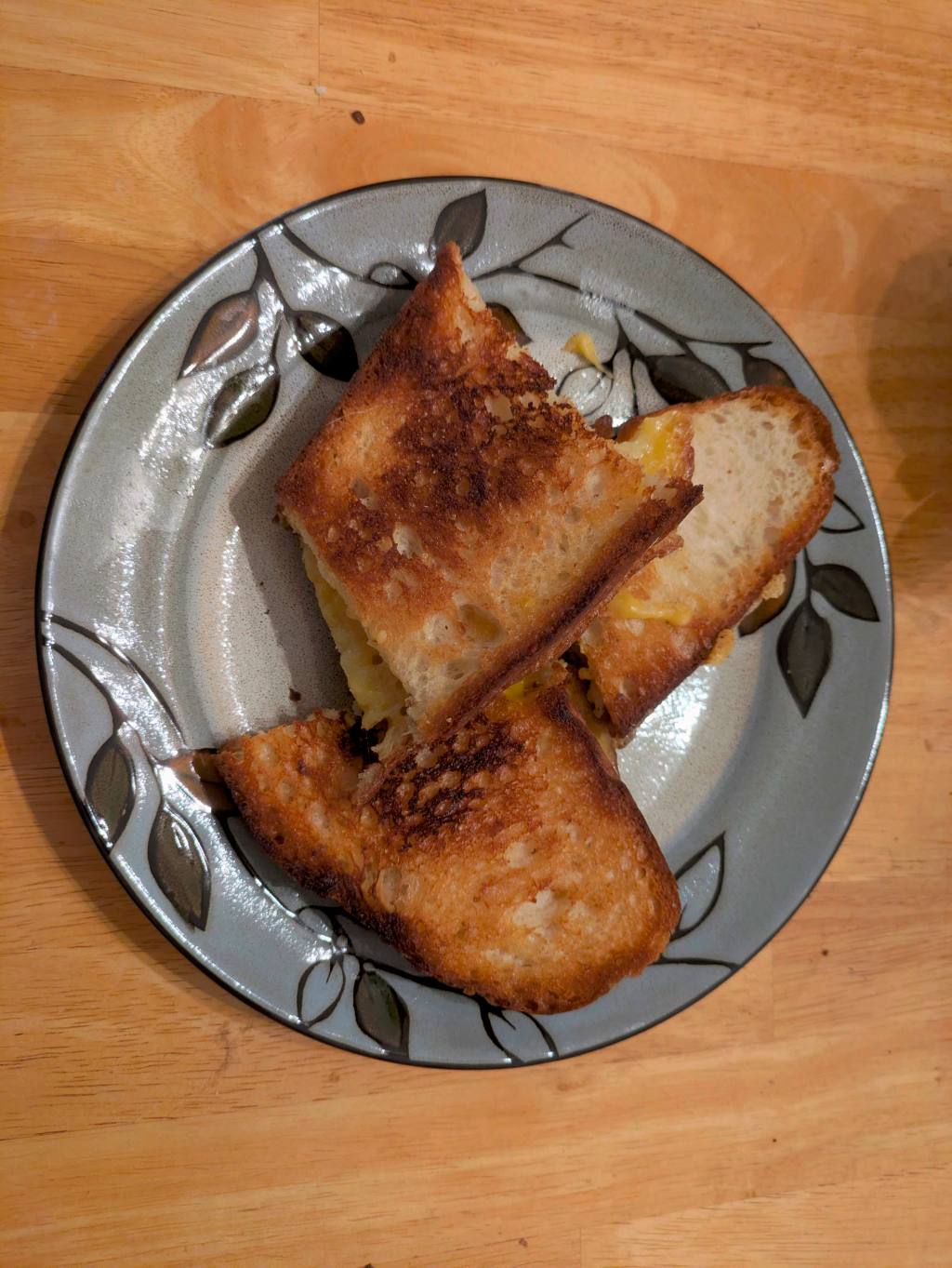 Photo of a perfectly toasted grilled cheese sandwich on Turano bread - cut in thirds.