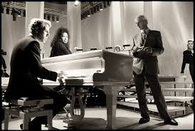 The Style Council around a piano - black and white