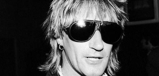 Close up of Rod Stewart wearing dark sunglasses.